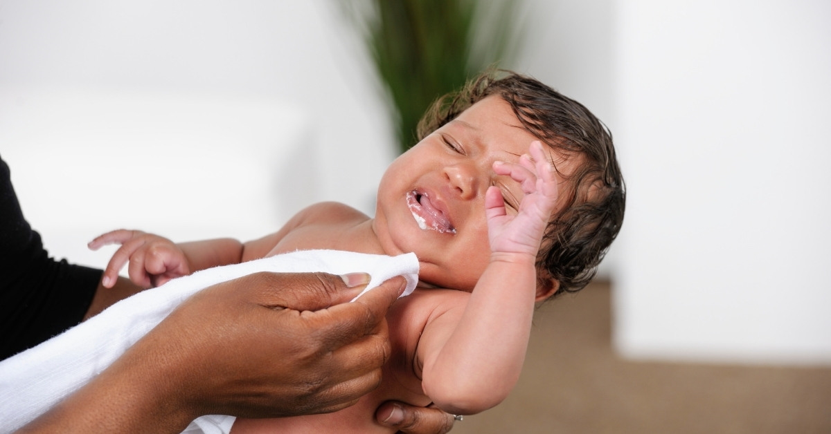 baby throws up when pooping