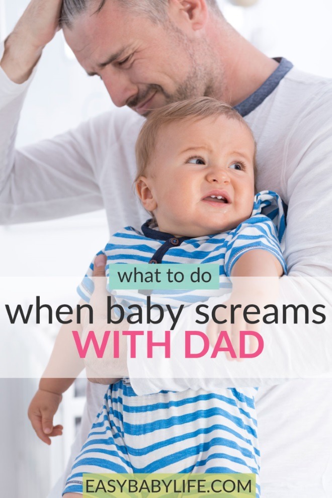 baby screams when dad holds him