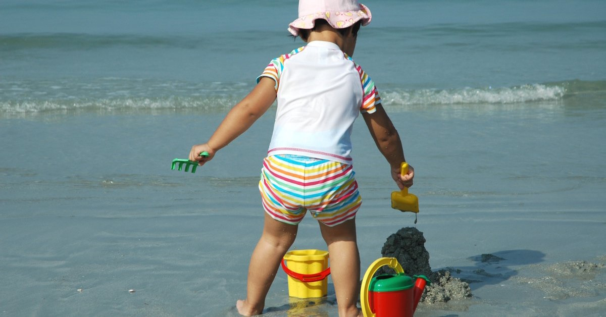 sand and water sensory play at the beach