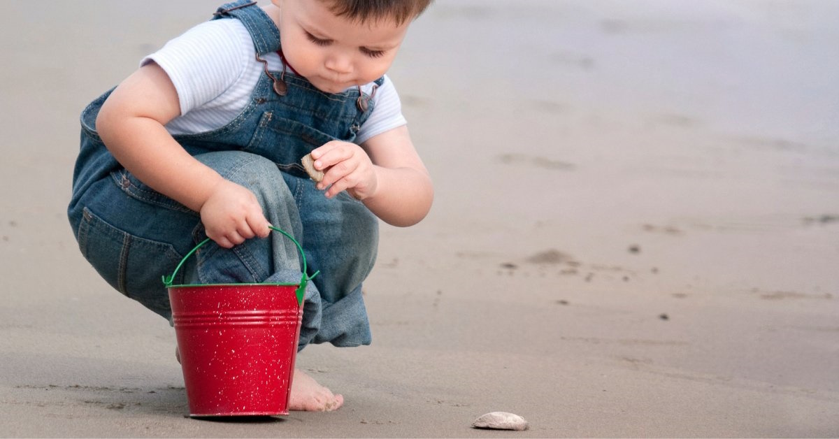 toddler stone hunt at the beach